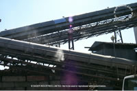 nozzle on covered waste conveyor
